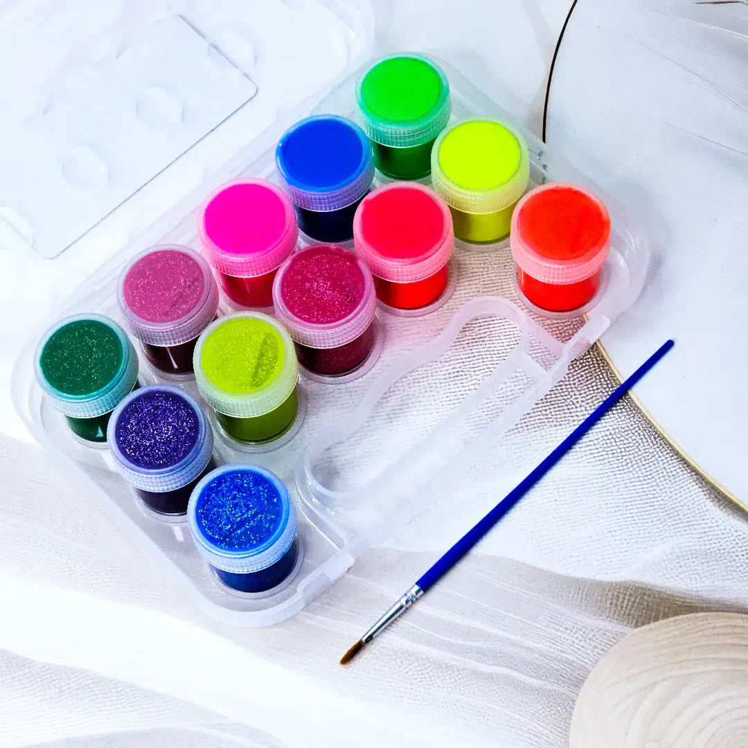 12 Color Fluorescent and Metallic Glitter Paint Set in a clear plastic case with a brush, ideal for kids' art projects. www.usmile.toys