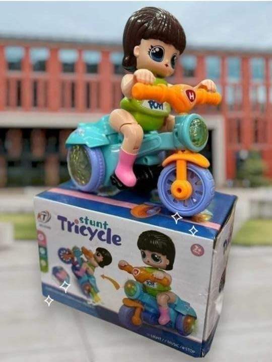 "U Smile Toys Musical 360° Rotating Stunt Electric Tricycle Toy, a bright blue battery-operated toy featuring a girl character rider, music, LED lights, and unique spinning action, engaging children and toddlers."
