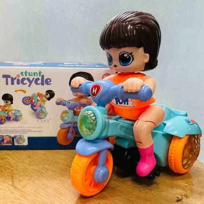 "U Smile Toys Musical 360° Rotating Stunt Electric Tricycle Toy, a bright blue battery-operated toy featuring a girl character rider, music, LED lights, and unique spinning action, engaging children and toddlers."
