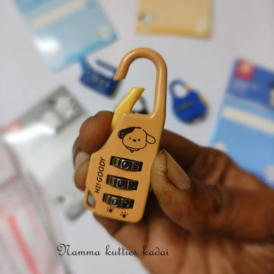 Hand holding a yellow combination lock with a cartoon face design, blurred background with similar locks.