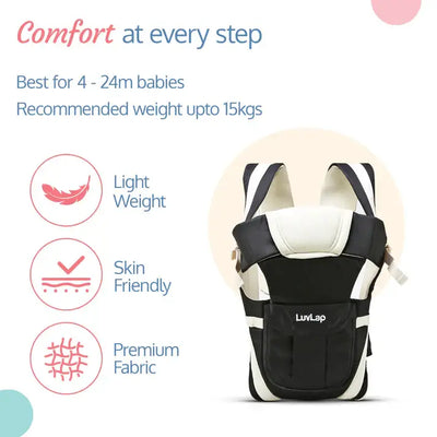 Smiling mother carrying a baby in a black Luvlap Elegant Baby Carrier with beige padding and straps, designed for comfortable and secure babywearing. Shows the baby facing towards the parent. From uSmile.toys." www.usmile.toys