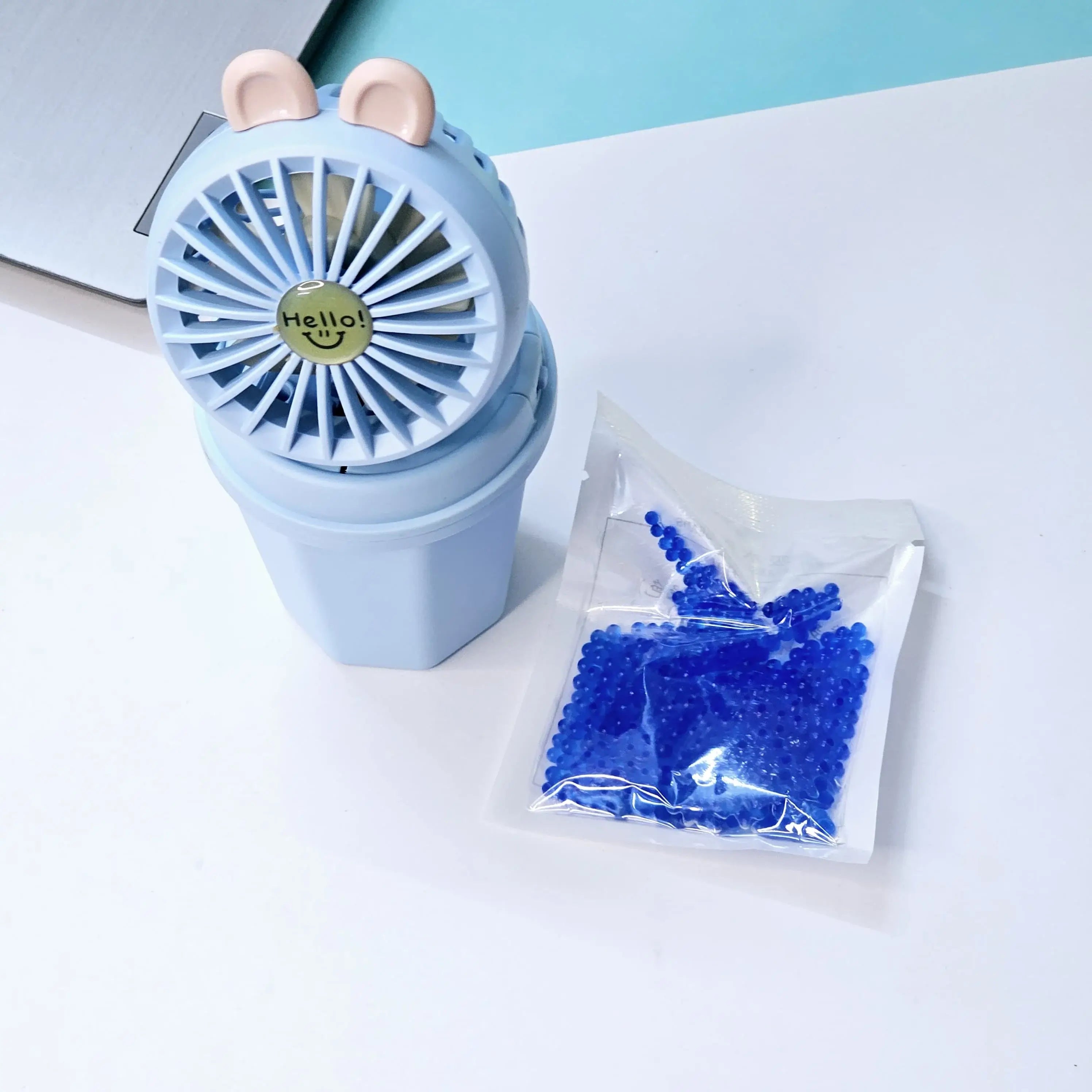 "Usmile Toys portable mini desk fan set for children, designed with an adorable bunny ear top and a compact base, perfect for study or play areas, available in blue and pink." www.usmile.toys