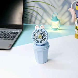 "Usmile Toys portable mini desk fan set for children, designed with an adorable bunny ear top and a compact base, perfect for study or play areas, available in blue and pink." www.usmile.toys