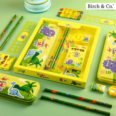 Children's stationery set with dinosaur design on a green background, featuring Birch & Co. branding.