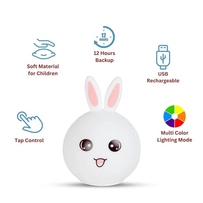 Cute white silicone rabbit night light with pink ears and an adorable face, glowing softly. In the background, two more rabbit lamps glow blue and orange, showcasing the color-changing feature. Perfect as a bedside lamp or nursery decor for kids and adults, providing comforting illumination. www.usmile.com