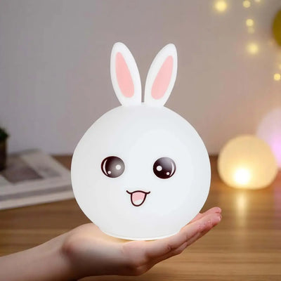White silicone rabbit night light with pink ears. www.usmile.com