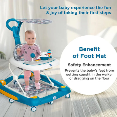Baby walker with foot mat feature and child using it on a light wooden floor.