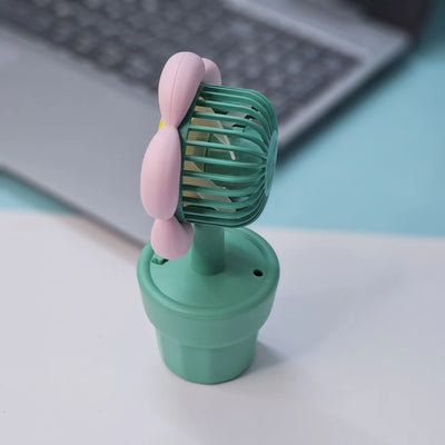 Set of three Usmile Toys flower-shaped mini desk fans in yellow, purple, and pink, each in a green pot with 'smile' text, perfect for kids' rooms or desks."