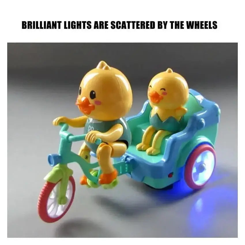 "Animated duck toy cycling on a tricycle, a fun musical toy that moves and lights up to encourage crawling and play in infants." www.usmile.toys