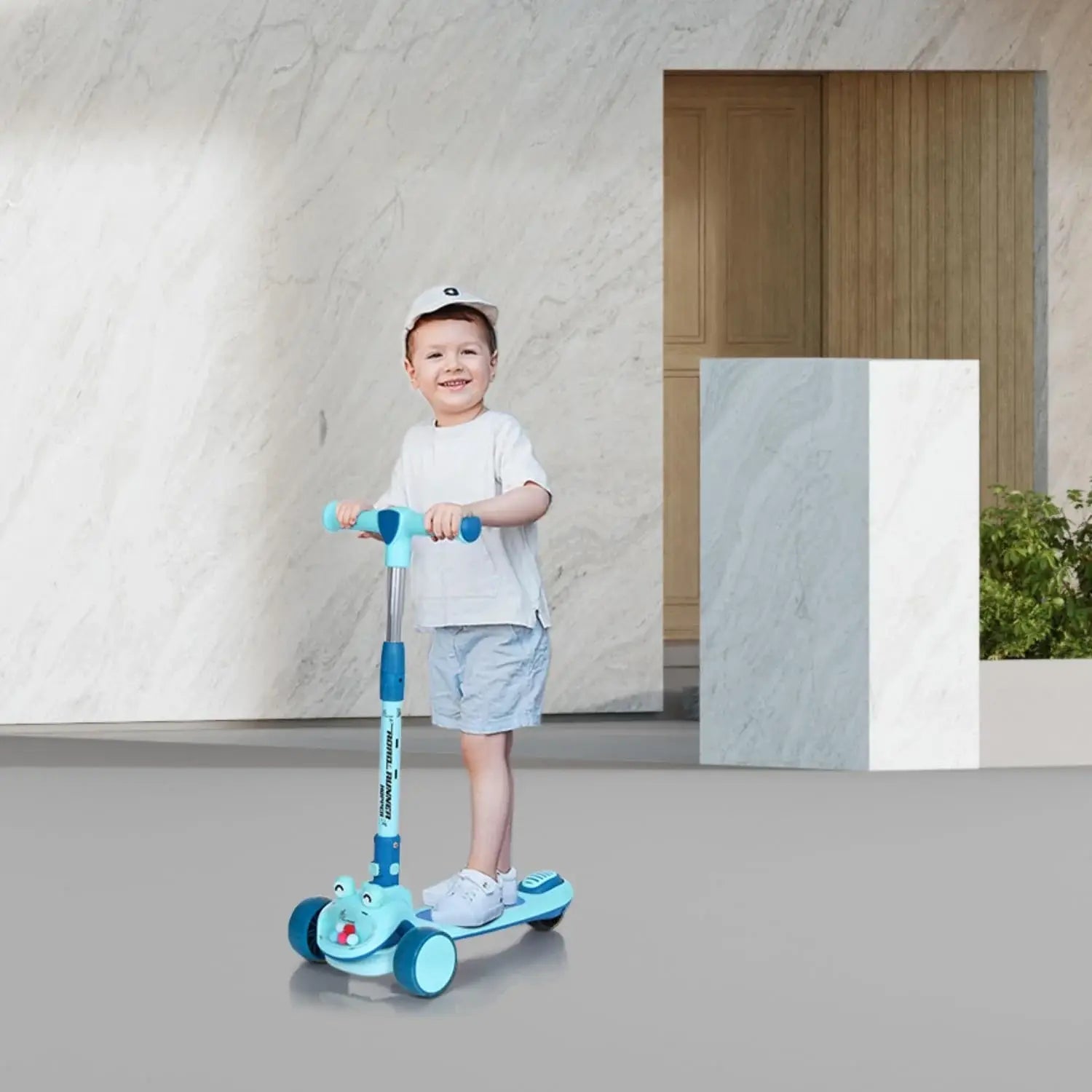 "R for Rabbit Road Runner Hopper 3-wheel Kick Scooter in blue, featuring a foldable design, glowing LED wheels, and a cute 'frog' or 'character' front for engaging fun for kids 3 years and above." www.usmile.toys