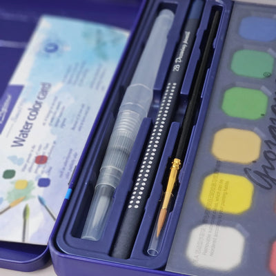 Usmile Toys art supplies: a 'Compulsory Course' 12-color solid watercolor cake set, complete with water brush and sponge, as shown on its packaging." www.usmile.toys