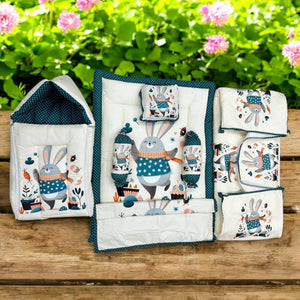 7 in 1 newborn baby bedding combo set in light green with cute elephant and leaf prints. Includes a baby sleeping bag, mattress, two bolsters, pillow, and two zip-up blankets, perfect for comfortable and safe infant sleep. Ideal for baby shower gifts and nursery decor. www.usmile.com