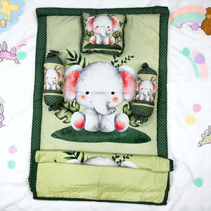 Adorable 7-piece baby bedding set featuring playful elephant designs, providing a complete and cozy sleep solution for newborns. This versatile combo is a must-have for new parents, ensuring comfort and safety. www.usmile.com