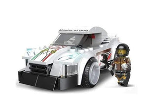 White and black "Multificence" racing car model building blocks set (181 pieces, Ages 6+), forming a sports car with a driver minifigure. Ideal learning kit for kids and aspiring builders from usmile.toys. www.usmile.toys