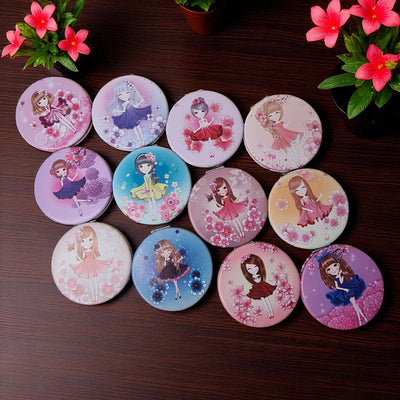 Set of round coasters with cartoon character designs on a wooden surface with flowers.