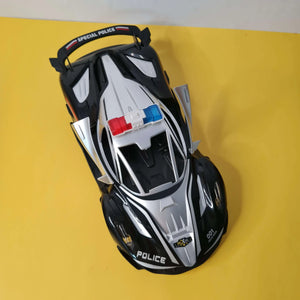 Toy police car on a yellow background