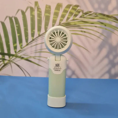 Colorful collection of portable bladeless mini fans for kids in pastel pink, green, blue with bear ears, and cream, designed with a child-safe bladeless head and single-button operation. These rechargeable USB fans are ideal for travel, school desks, or bedtime comfort, offering quiet and efficient cooling in a cute, compact design. Perfect return gift or utility item for children, available at U Smile Toys online store