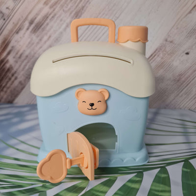 Children's cup with bear design on a wooden surface