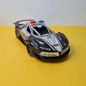 Toy police car with sirens on a yellow and gray background