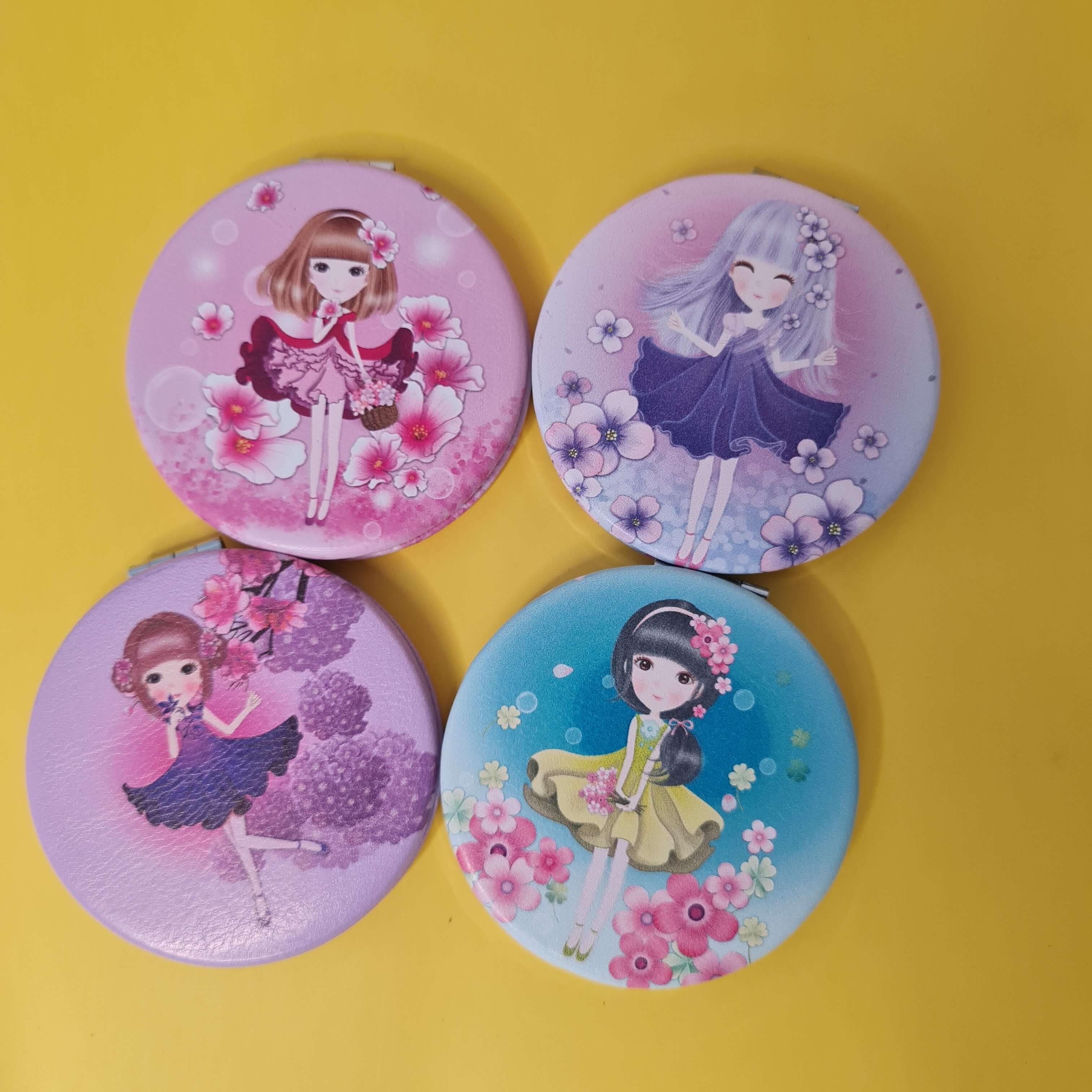 Four round buttons with cartoon characters on a yellow background