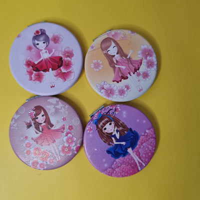 Four round mirrors with cartoon character designs on a yellow background