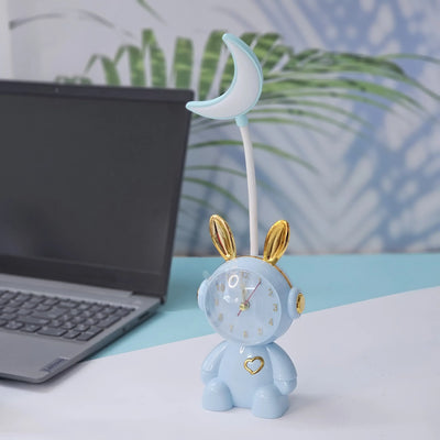 Buy the Usmile Toys adorable pink bunny clock with moon night light for your child's room. This fun alarm clock and soft lamp helps create a soothing bedtime routine." www.usmile.toys