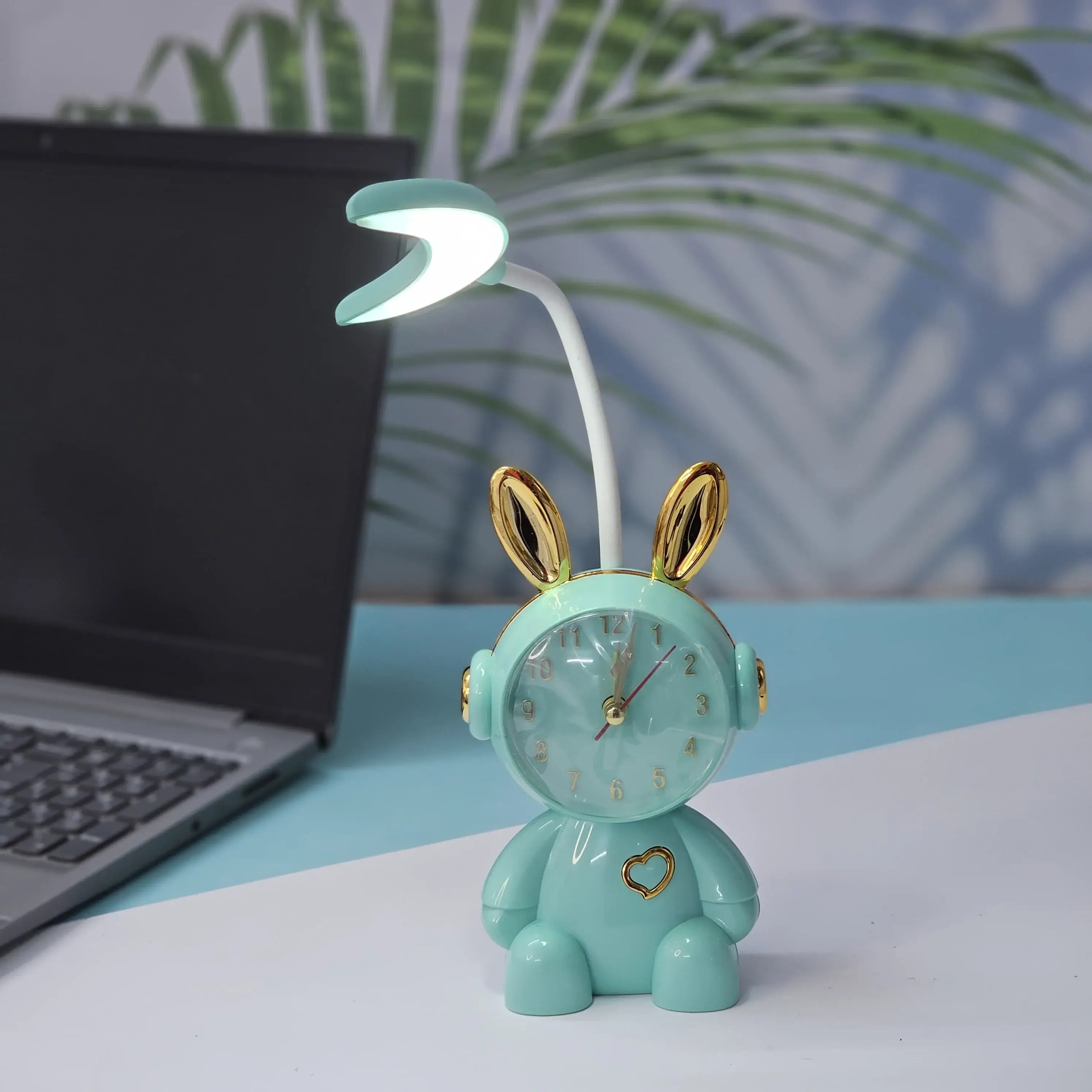 Buy the Usmile Toys adorable pink bunny clock with moon night light for your child's room. This fun alarm clock and soft lamp helps create a soothing bedtime routine." www.usmile.toys