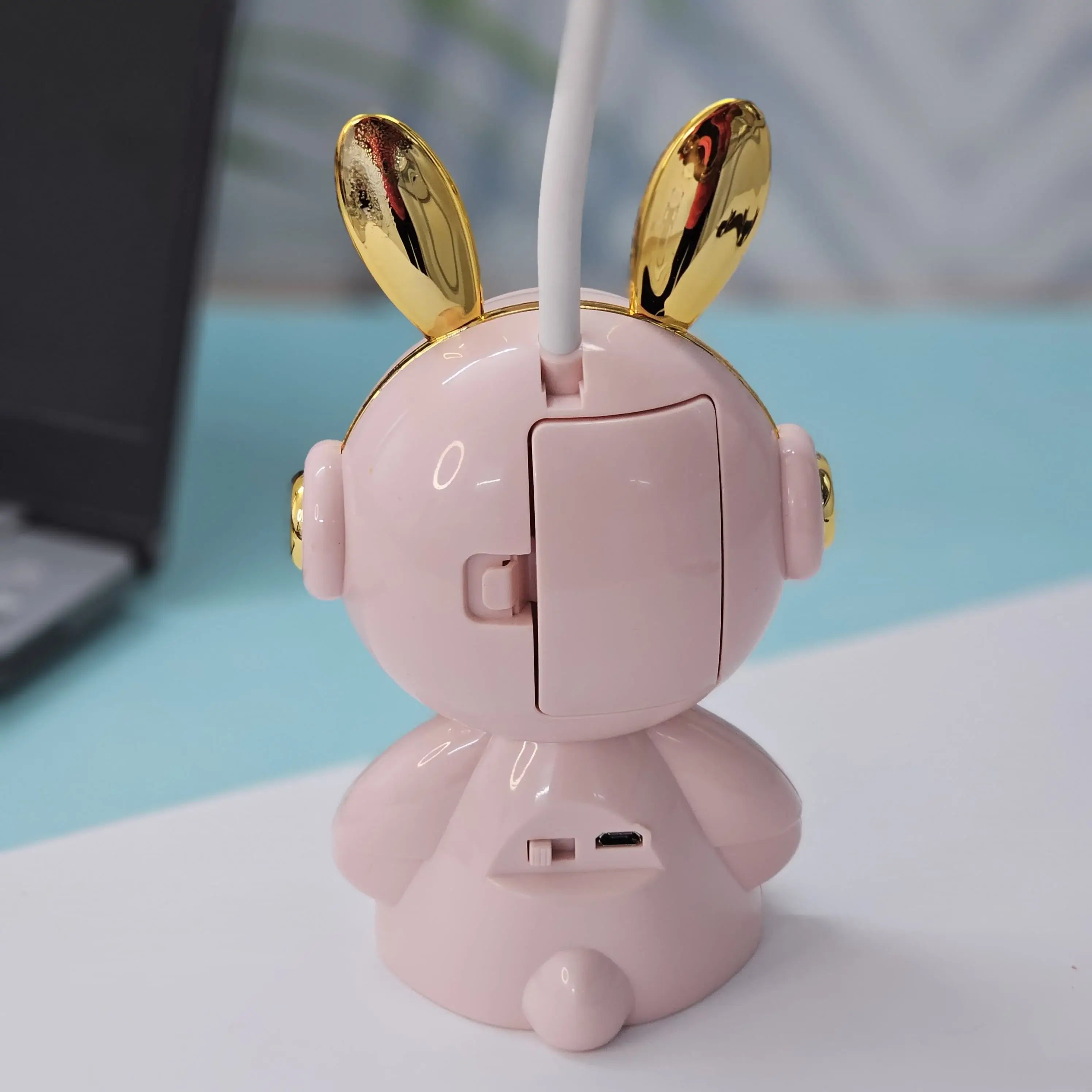 Buy the Usmile Toys adorable pink bunny clock with moon night light for your child's room. This fun alarm clock and soft lamp helps create a soothing bedtime routine." www.usmile.toys