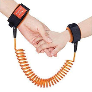 Close-up of a vibrant blue child safety wrist link, showing soft, adjustable cuffs on two wrists and a strong, flexible coiled tether, ideal for preventing children from wandering off, from Usmile Toys. www.usmile.toys