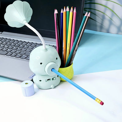 Set of three Usmile Toys Astronaut Teddy Lamps in blue, pink, and green, each featuring a glowing flower-shaped light and a base designed as a convenient pencil holder." www.usmile.com