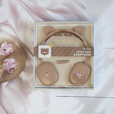 ute Rabbit wired headphones with bear face design on earcups, in a soft pink color, displayed on a white surface.           www.usmile.toys