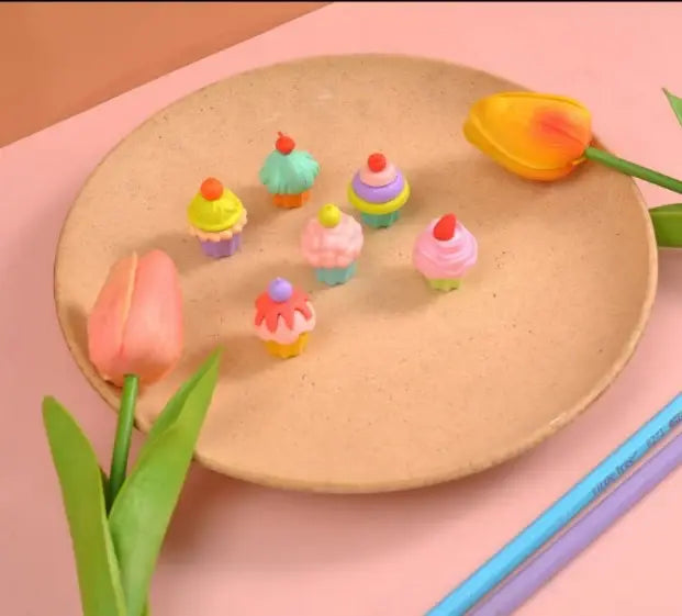 Cupcake erasers with various colors and toppings, packaged in a decorative blister pack  www.usmile.toys