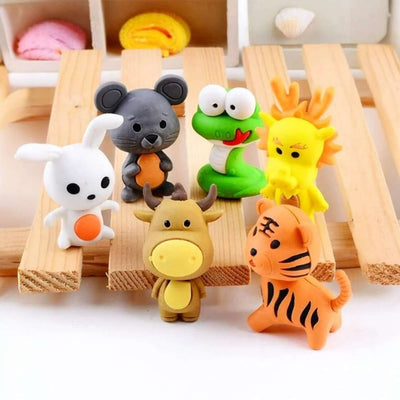 Set of colorful animal figurines on a wooden surface