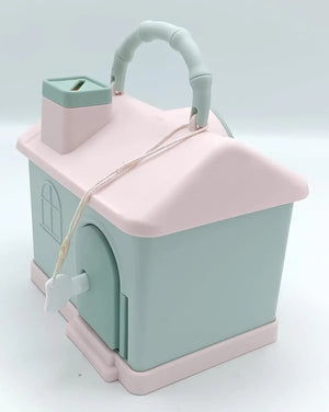 Kids' house money bank with lock, key, and 3D sticker compatibility, in pastel pink and blue. www.usmile.toys