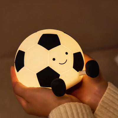 Score big on bedtime comfort with this fun football-shaped silicone night light, perfect for kids who love sports. Provides a soft, comforting glow for sweet dreams. Find it at uSmile.toys." www.usmile.toys