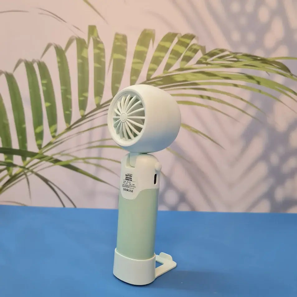 Colorful collection of portable bladeless mini fans for kids in pastel pink, green, blue with bear ears, and cream, designed with a child-safe bladeless head and single-button operation. These rechargeable USB fans are ideal for travel, school desks, or bedtime comfort, offering quiet and efficient cooling in a cute, compact design. Perfect return gift or utility item for children, available at U Smile Toys online store
