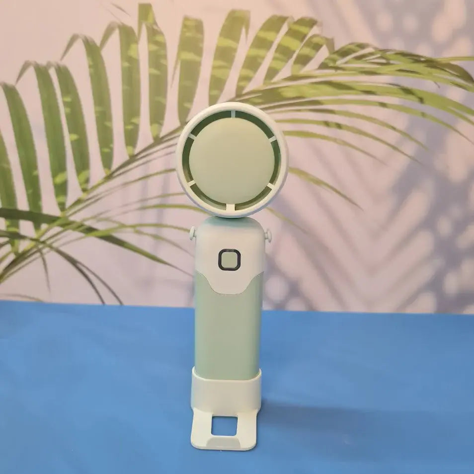 Colorful collection of portable bladeless mini fans for kids in pastel pink, green, blue with bear ears, and cream, designed with a child-safe bladeless head and single-button operation. These rechargeable USB fans are ideal for travel, school desks, or bedtime comfort, offering quiet and efficient cooling in a cute, compact design. Perfect return gift or utility item for children, available at U Smile Toys online store