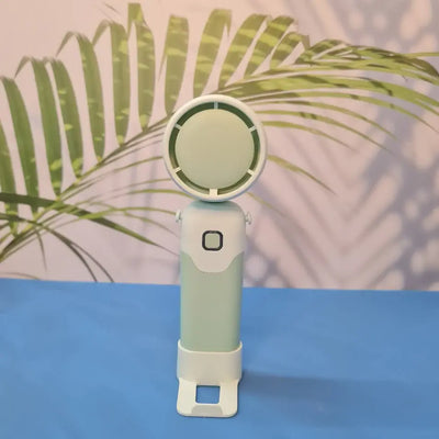 Colorful collection of portable bladeless mini fans for kids in pastel pink, green, blue with bear ears, and cream, designed with a child-safe bladeless head and single-button operation. These rechargeable USB fans are ideal for travel, school desks, or bedtime comfort, offering quiet and efficient cooling in a cute, compact design. Perfect return gift or utility item for children, available at U Smile Toys online store