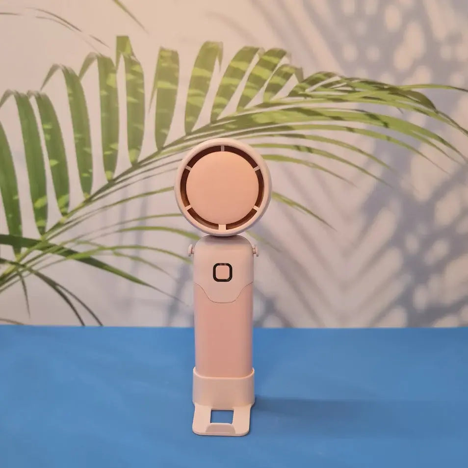 Colorful collection of portable bladeless mini fans for kids in pastel pink, green, blue with bear ears, and cream, designed with a child-safe bladeless head and single-button operation. These rechargeable USB fans are ideal for travel, school desks, or bedtime comfort, offering quiet and efficient cooling in a cute, compact design. Perfect return gift or utility item for children, available at U Smile Toys online store