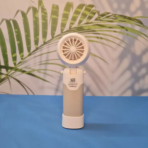 Colorful collection of portable bladeless mini fans for kids in pastel pink, green, blue with bear ears, and cream, designed with a child-safe bladeless head and single-button operation. These rechargeable USB fans are ideal for travel, school desks, or bedtime comfort, offering quiet and efficient cooling in a cute, compact design. Perfect return gift or utility item for children, available at U Smile Toys online store
