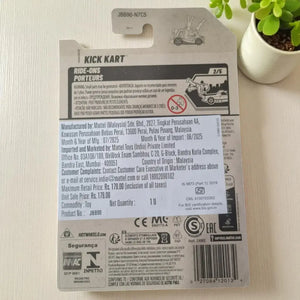 Back of a toy packaging with branding and product details on a light surface.