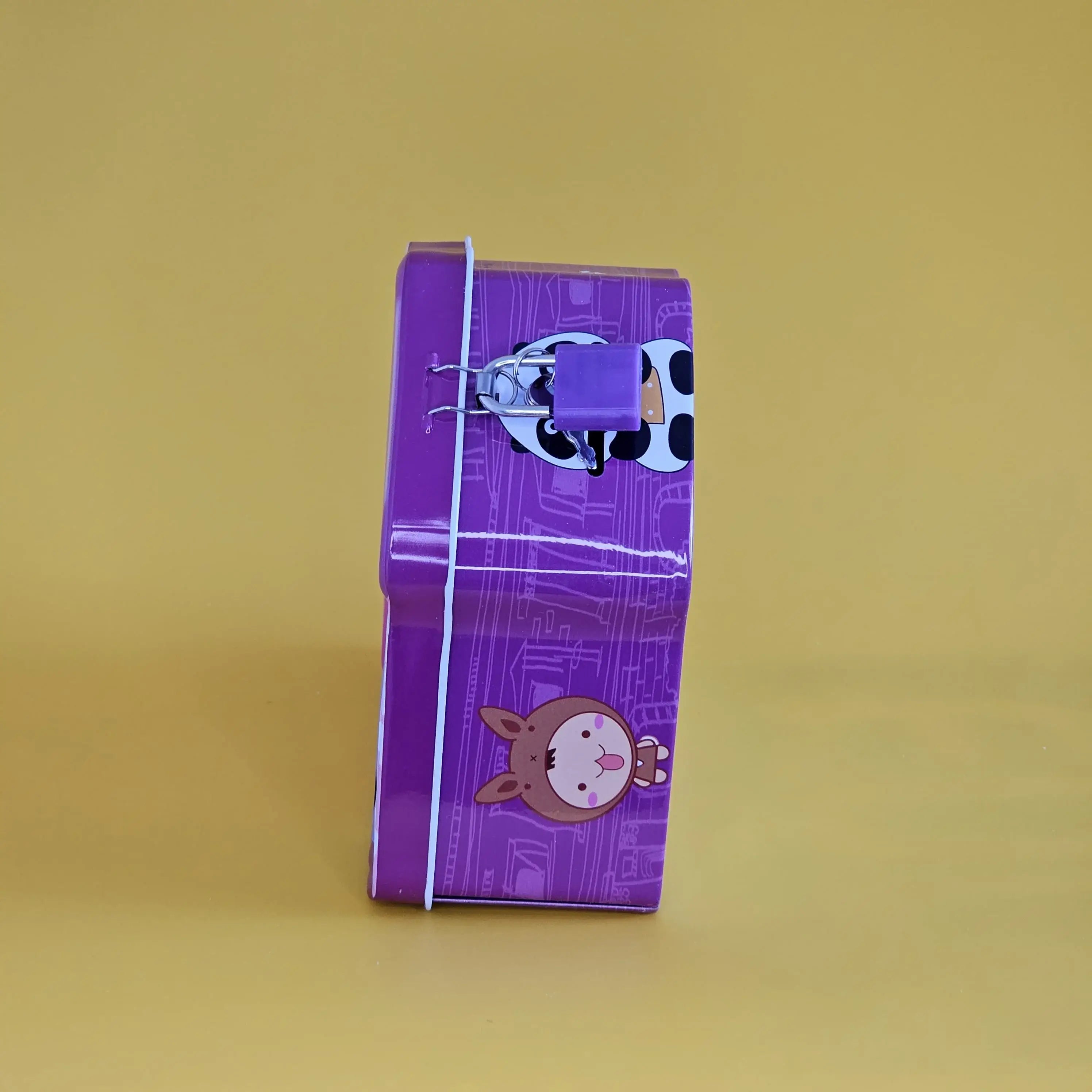 Fun and educational metal coin banks for kids, designed as miniature houses with different colors and animal faces, encouraging savings, find at usmile.toys