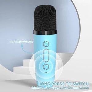Close-up of a Usmile Toys kids' karaoke system, including a blue Bluetooth speaker with an animated dinosaur and a handheld wireless microphone, perfect for singing." www.usmile.toys