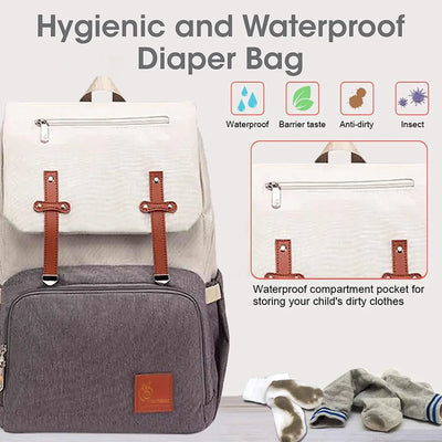 Gray diaper bag with brown straps and a white top section, featuring text about its hygienic and waterproof properties.