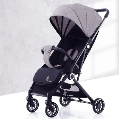 Black and gray baby stroller on a white background