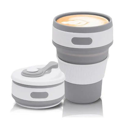 Collapsible travel mug with a white interior and gray exterior on a white background