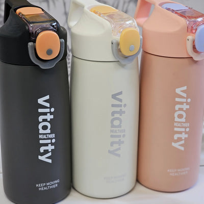 Stainless steel water bottles for kids and adults, featuring double-walled insulation, flip-top lids, and 'keep moving healthier www.usmile.toys