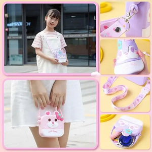 Usmile Toys cute purple silicone 'Flower Bunny' sling bag for girls, shaped like a cartoon rabbit face with a blue flower, accompanied by a matching compact mirror, comb, and a small doll." www.usmile.toys