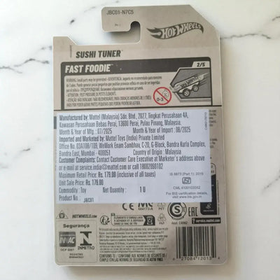Hot Wheels Sushi Tuner toy packaging on a marble surface