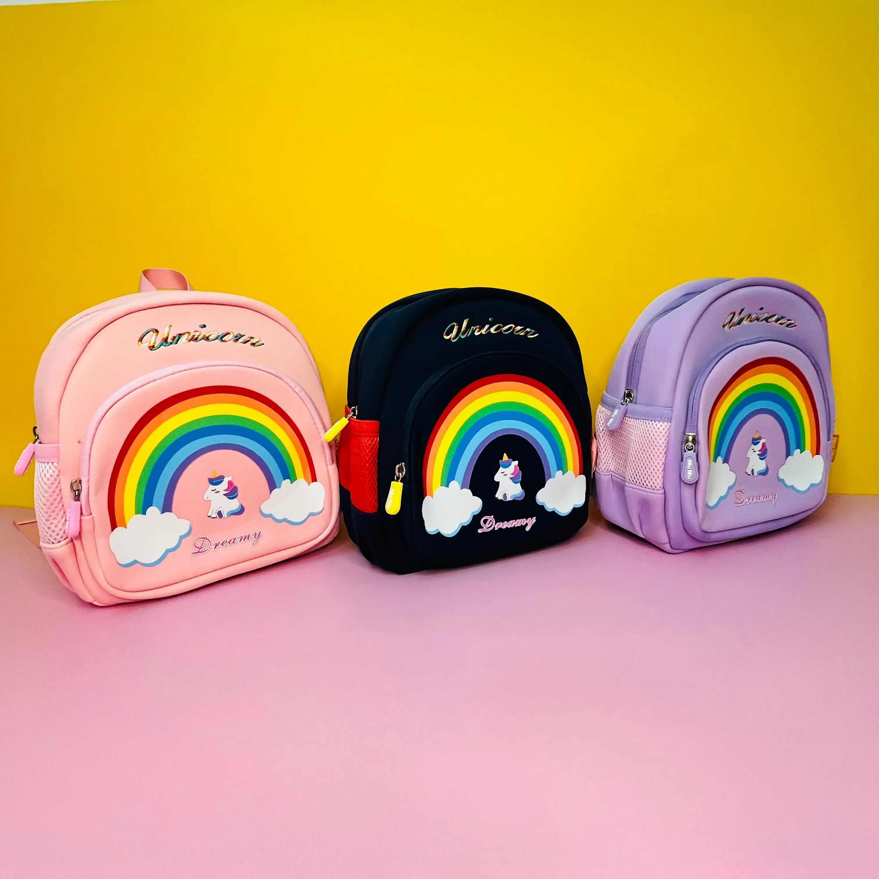 Set of three unicorn-themed kids' backpacks with rainbow design – perfect for school and travel."

"Unicorn children bags with safety features – available in pink, navy blue, and purple Usmile.toys